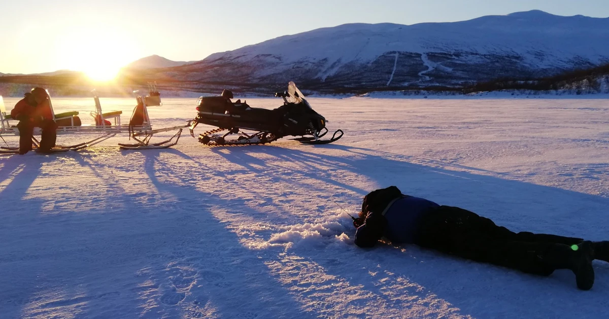 Ice Fishing on the Torne River from Aurora River Camp